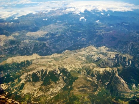 Mountains in the Alps in the south of Colmar, France - aerial view during flight