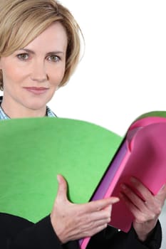 Woman holding brightly colored files
