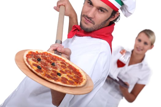 Pizza chef and waitress