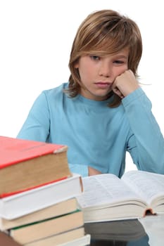 A bored child reading a book