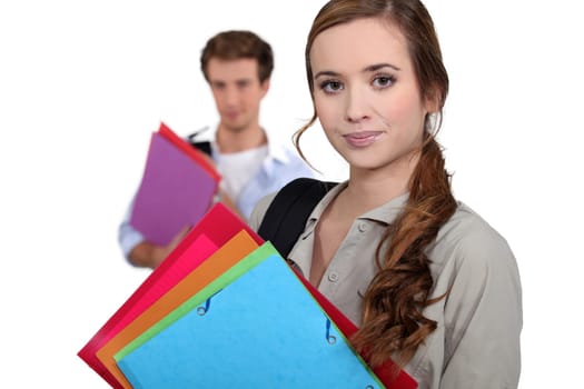 Students carrying folders