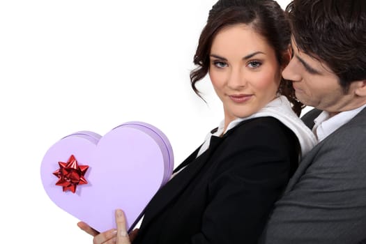 a woman, her boyfriend and a heartshaped box