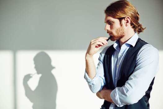 Portrait of pensive businessman in isolation