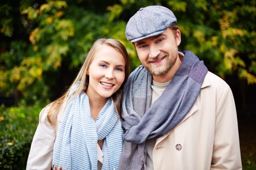 Stylish young man and woman looking at camera