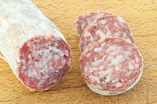 beautiful background of salami and slices on a cutting board