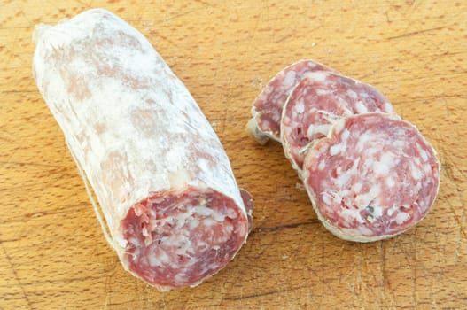 beautiful background of salami and slices on a cutting board