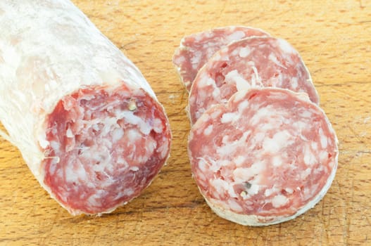beautiful background of salami and slices on a cutting board