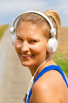 Young woman jogging with MP3 Player