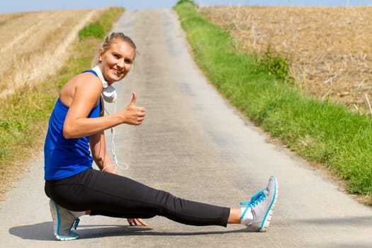 Young athlete with thumbs up