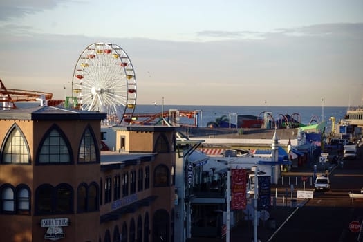 Los Angeles,United States - December 27,2015: Hotels and restaurants on Santa Monica Beach with the Santa Monica Pier amusement park in the background on December 27,2015 in Los Angeles.