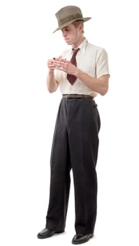 Young man with clothes and cap in 40s style isolated on white background
