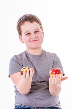 little boy with food isolated on white background - apple or a muffin