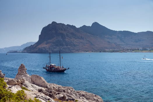 Kolymbia beach with the rocky coast in Greece.