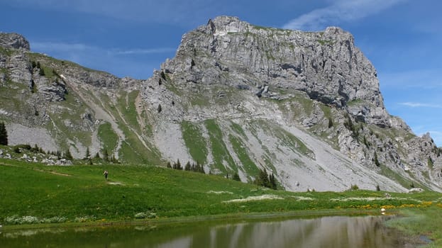 Mountain lake Les Gouilles in front of the Rueblihorn