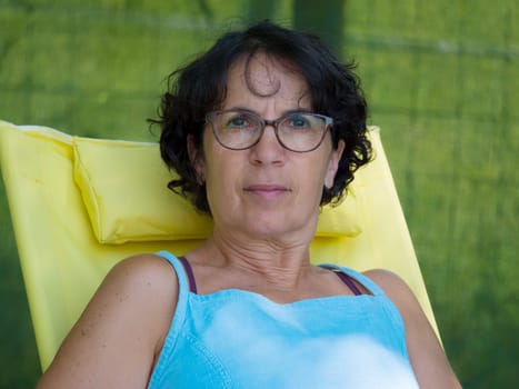 a portrait of a middle-aged woman, outside