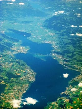 Lake Zurich / Zurichsee - aerial view during flight. View of bridge Seedamm and islands Ufenau Lutzelau