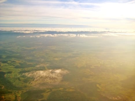 Flight over green landscape - sunrise / sunset