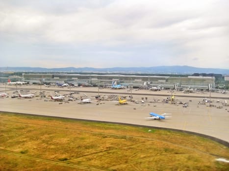 Frankfurt am Main, Germany - July 9, 2008: Airport Frankfurt / Main - Terminal with airplanes in parking position. View from runway during landing.