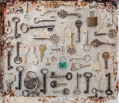 Various key on rusty metal background