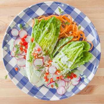 Colorful salad with radishes and yoghurt dressing