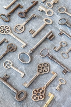 Various key on dark background made of wood