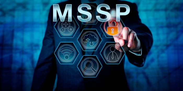 Male corporate network administrator is touching MSSP on an interactive virtual control screen. Business model metaphor and information technology concept for managed security service provider.