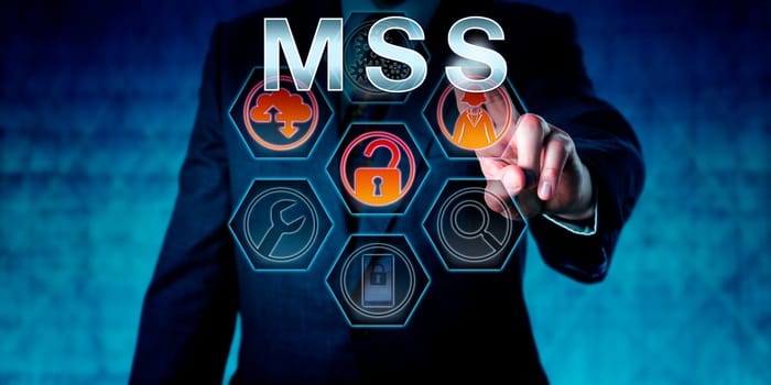 IT security expert touching MSS on an interactive virtual control screen. Business risk metaphor and computer network security concept for Managed Security Services outsourced to service providers.