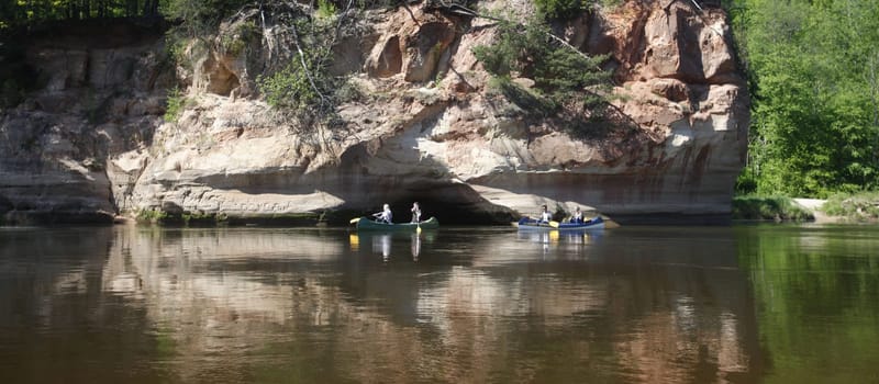 people on a canue trip on the gauja river near the town of sigulda near city of riga in latvia in the baltic region in europe.