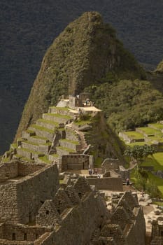 MACHU PICCHU, CUSCO, PERU - NOVEMBER 25, 2011: People Visiting Lost Incan City of Machu Picchu near Cusco in Peru. Peruvian Historical Sanctuary and UNESCO World Heritage Site.