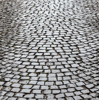 wet old historic cobble stone road