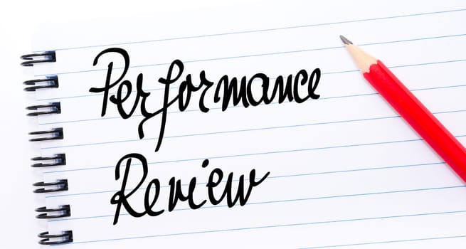 Performance Review written on notebook page with red pencil on the right