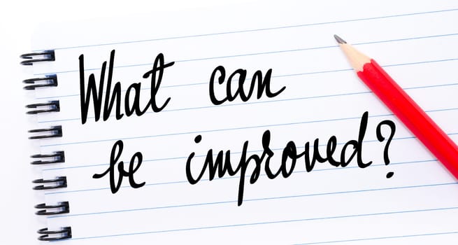 What Can Be Improved ? written on notebook page with red pencil on the right