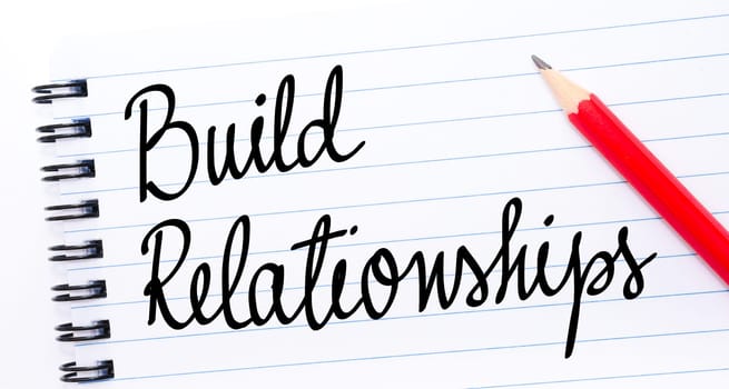 Build Relationships written on notebook page with red pencil on the right