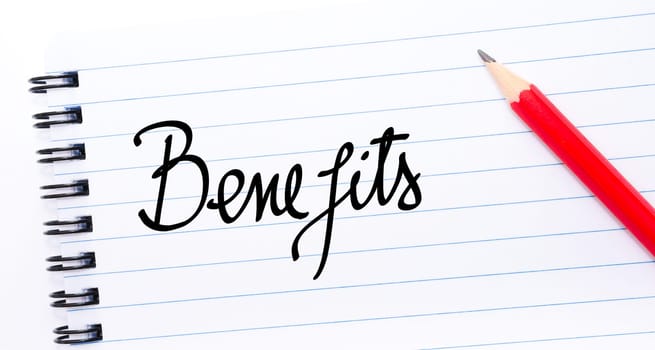 Benefits written on notebook page with red pencil on the right