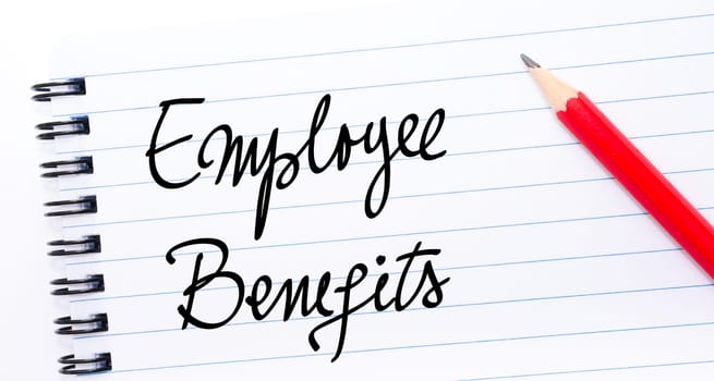 Employee Benefits written on notebook page with red pencil on the right