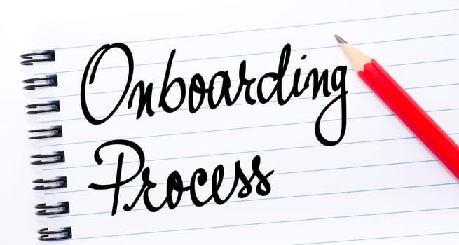 Onboarding Process written on notebook page with red pencil on the right