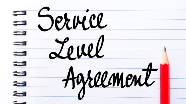 Service Level Agreement written on notebook page with red pencil on the right
