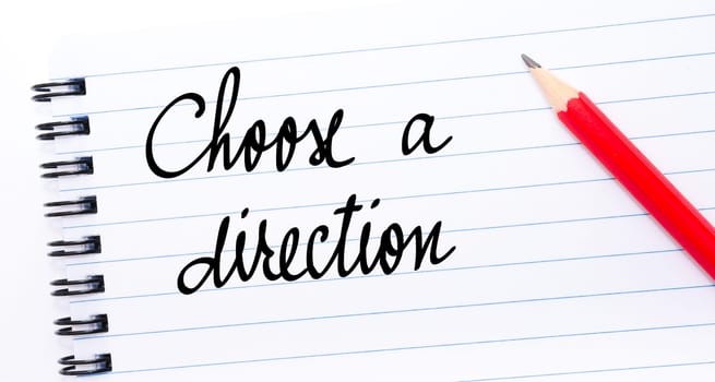 Choose A Direction written on notebook page with red pencil on the right
