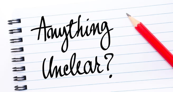 Anything Unclear ? written on notebook page with red pencil on the right
