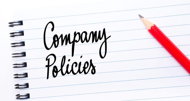 Company Policies written on notebook page with red pencil on the right