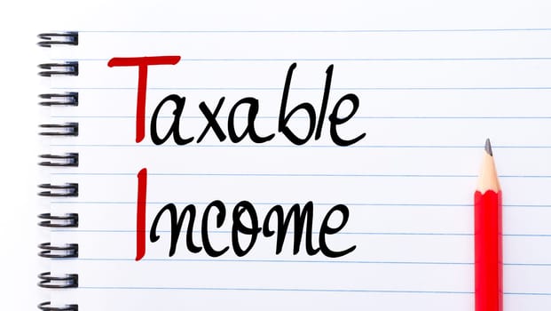 TI Taxable Income written on notebook page with red pencil on the right