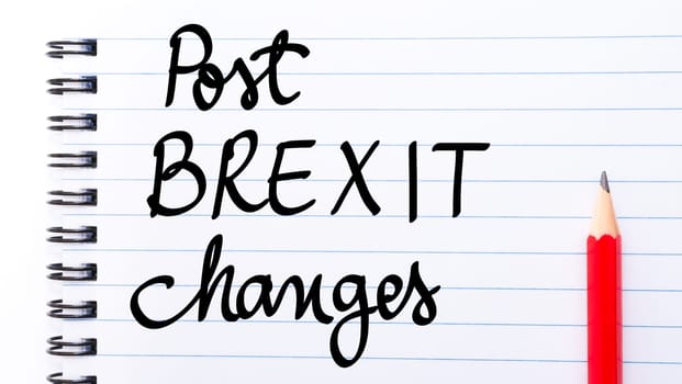 Post BREXIT changes written on notebook page with red pencil on the right
