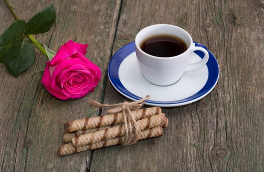 cup of coffee, linking of cookies and one red rose