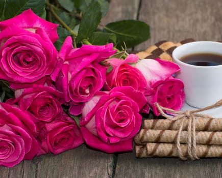 bouquet of red roses and coffee close-up