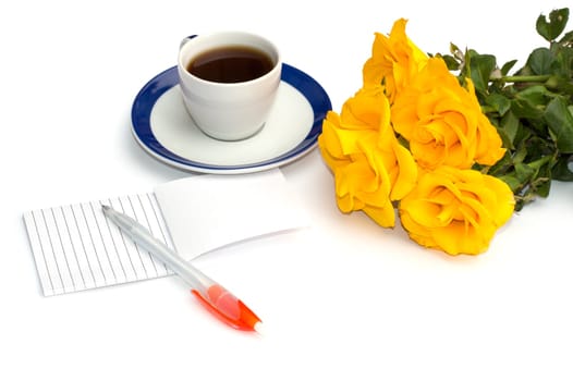 cup of coffee, notebook with the handle and a bouquet of yellow roses, the front view, a greeting card on a subject flowers