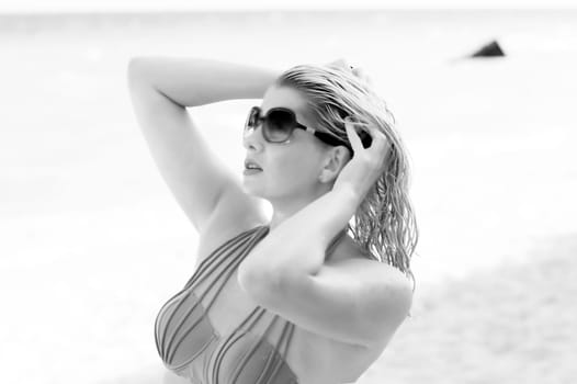black-and-white portrait of the beautiful woman with wet hair