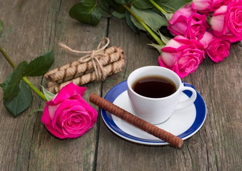 festive card, coffee and red roses, still life on a subject flowers and drinks