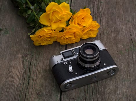 film retro camera and bouquet of yellow roses, subject festive card, flowers