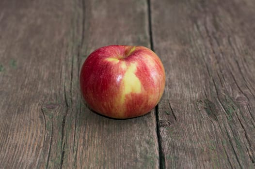 apple on an old wooden table, a subject fruit