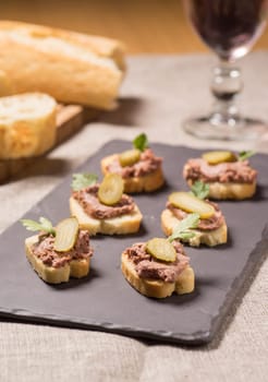 Appetizer with pate served on a Slate plate